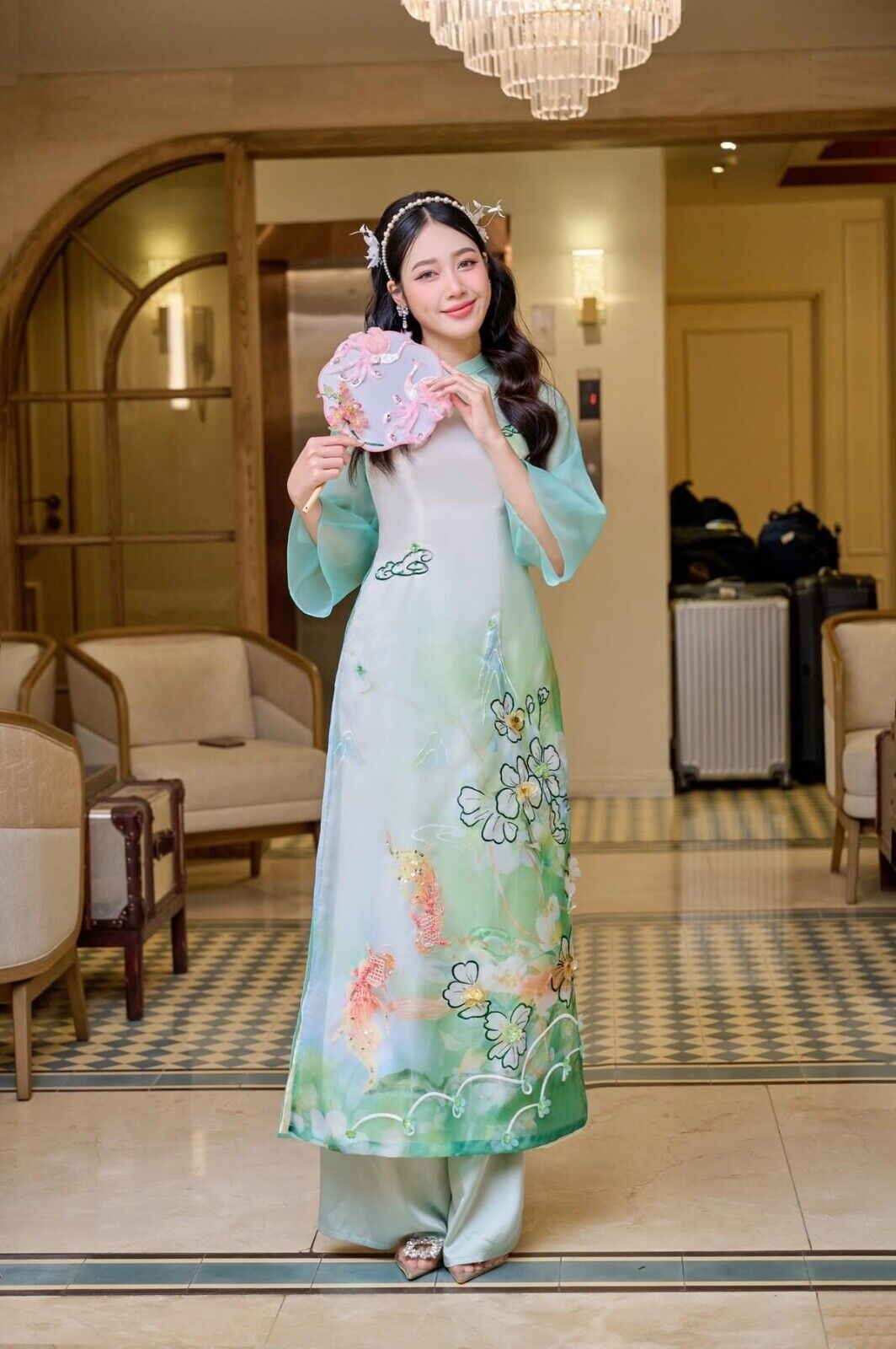 Modern Ao dai with koi fish embellishments