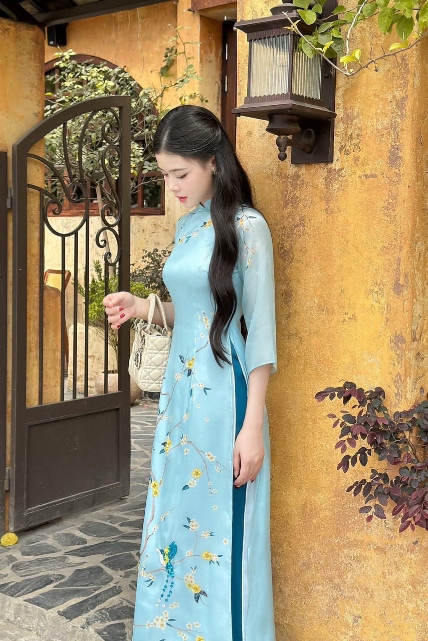 Vietnamese traditional áo dài with bird embellishments