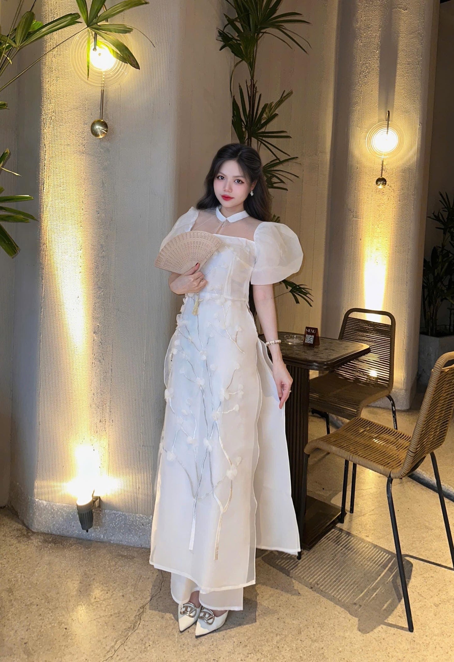 Vietnamese modern white áo dài with puff sleeves