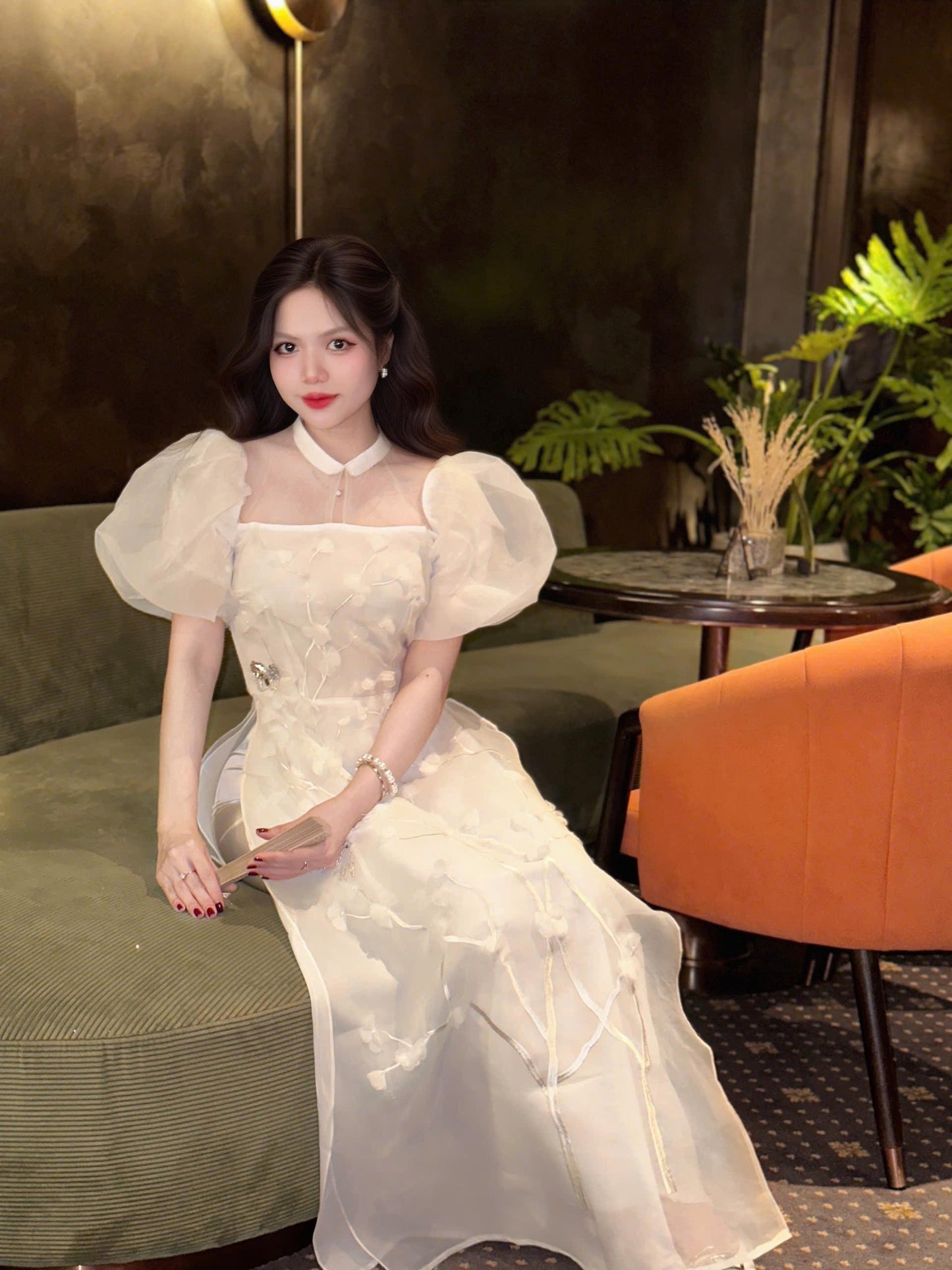 Vietnamese modern white áo dài with puff sleeves
