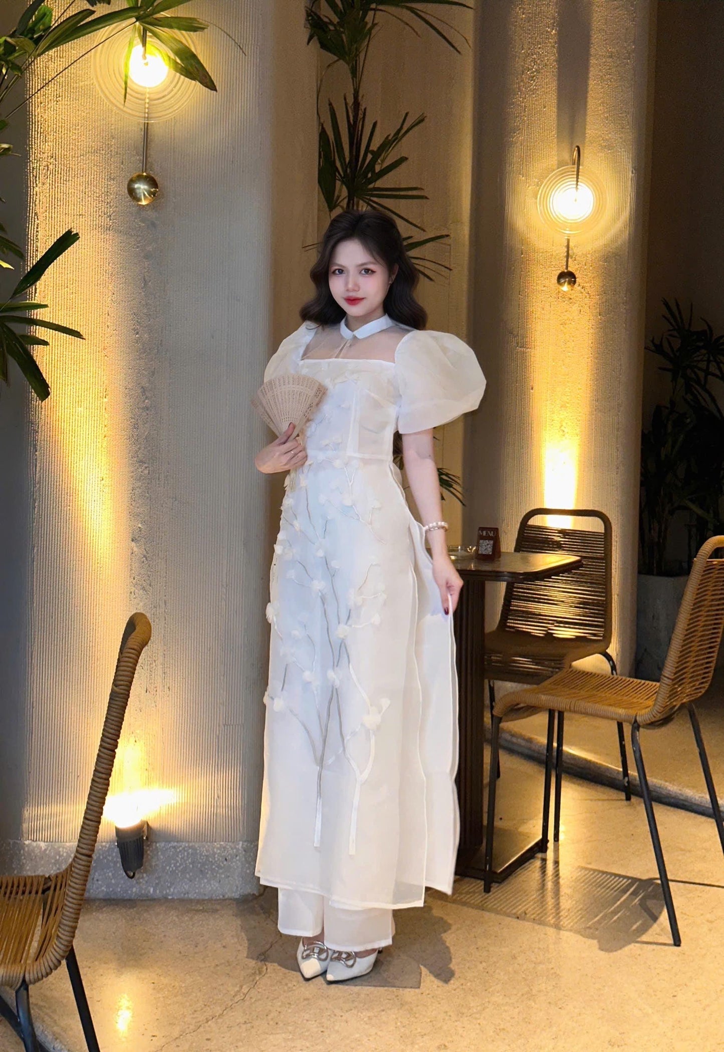 Vietnamese modern white áo dài with puff sleeves