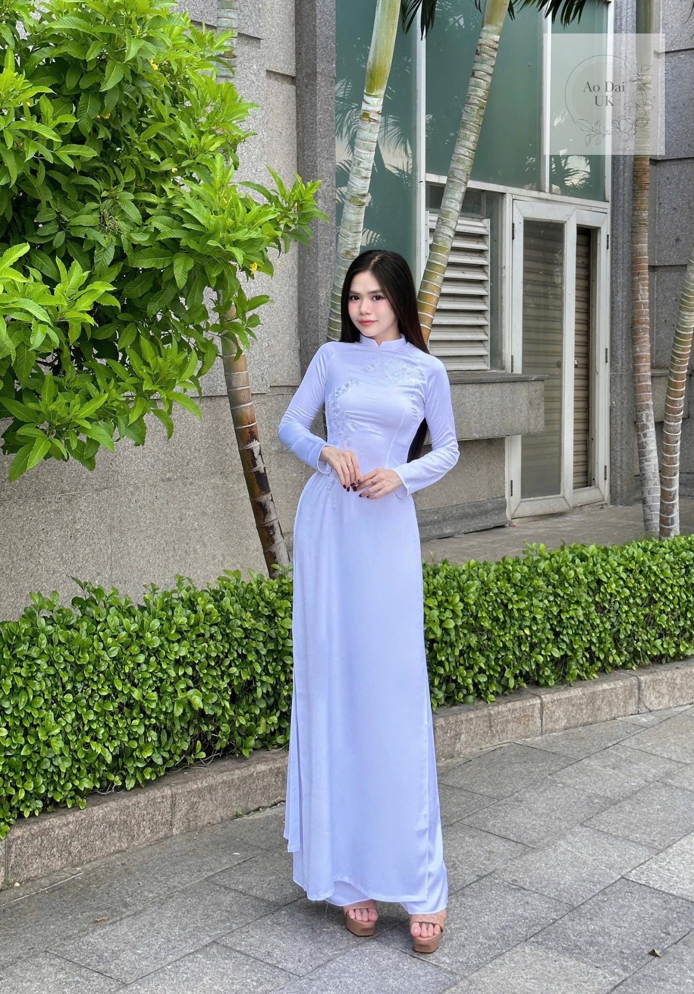 Traditional white ao dai with floral embroidery