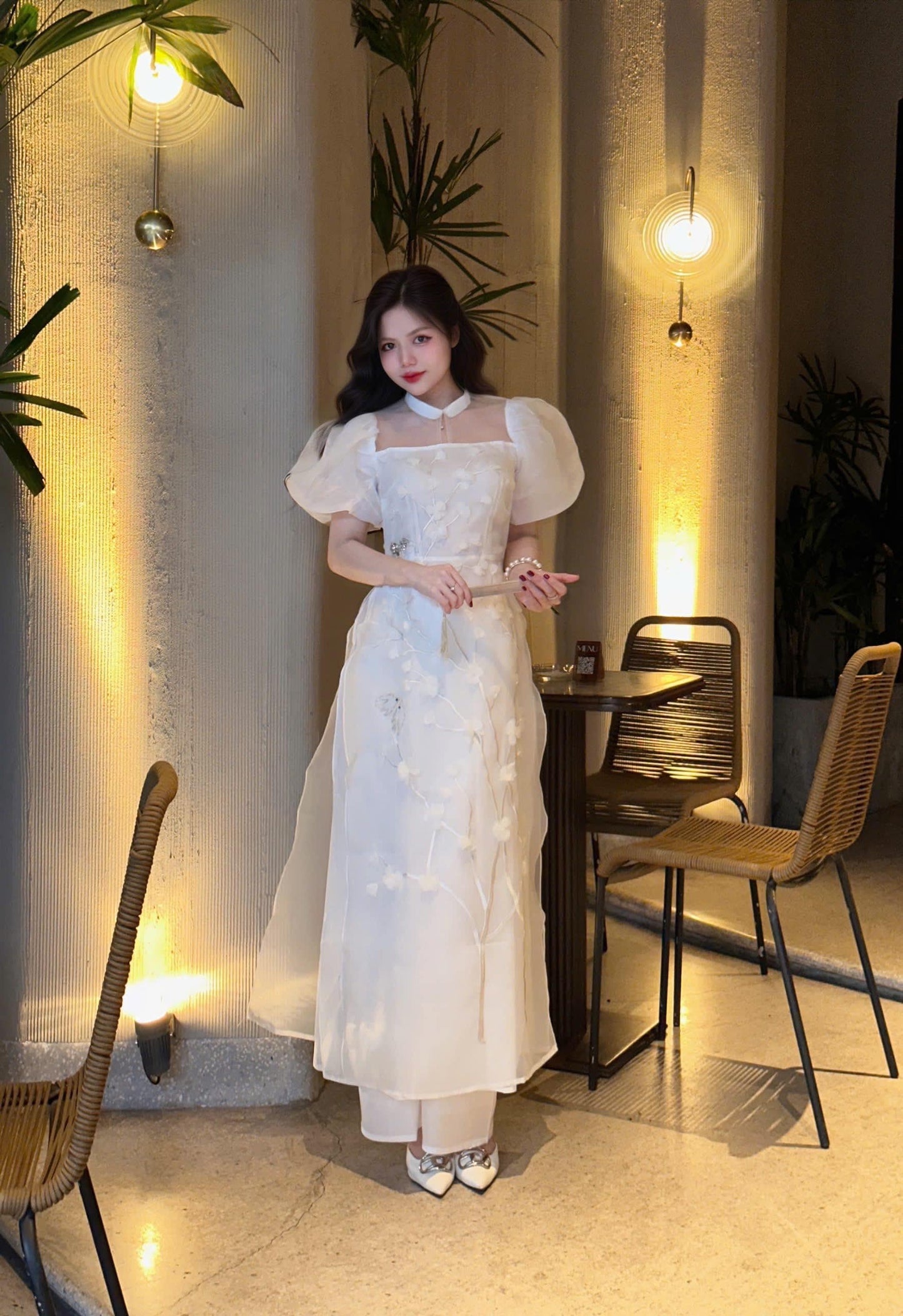 Vietnamese modern white áo dài with puff sleeves