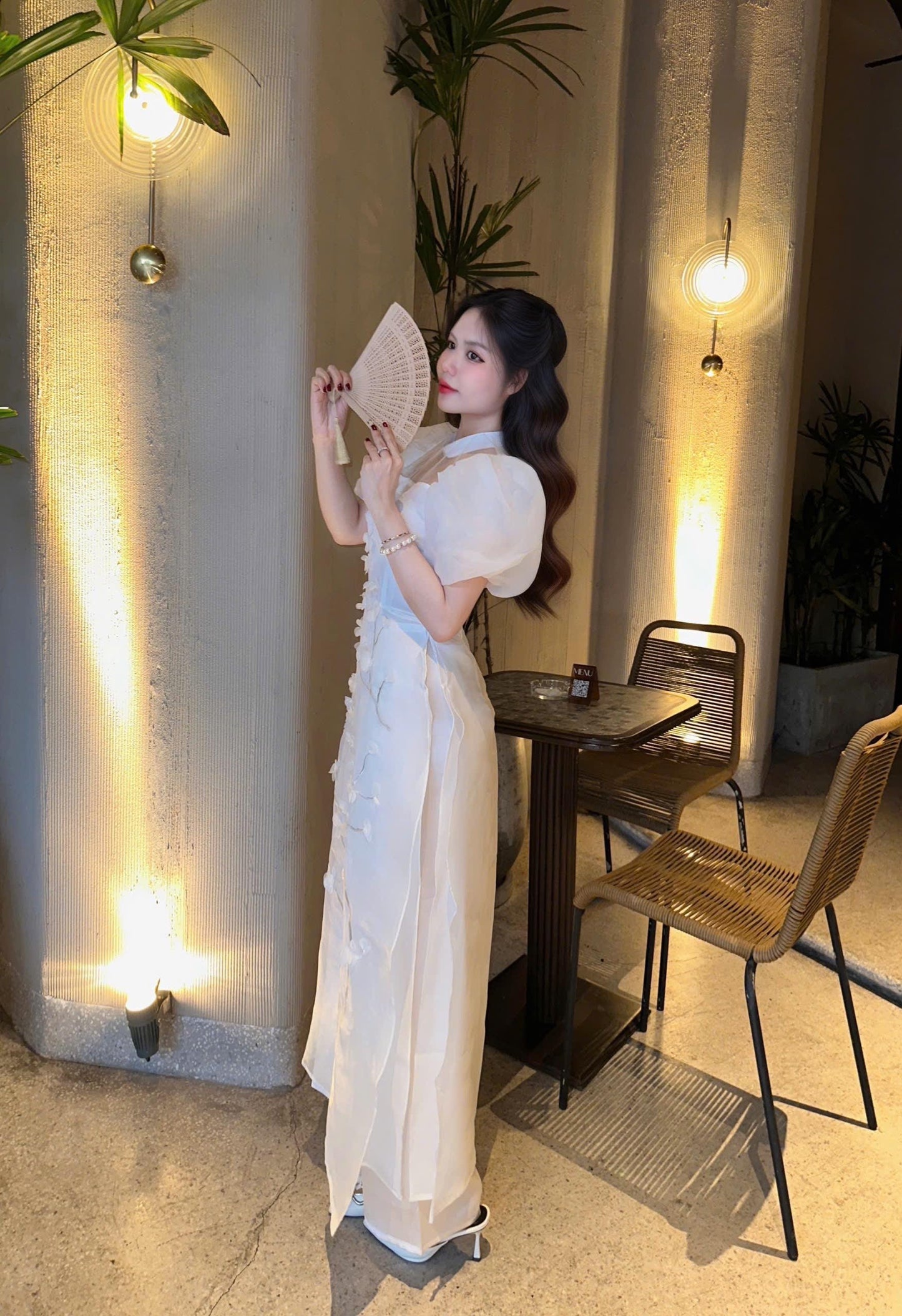 Vietnamese modern white áo dài with puff sleeves
