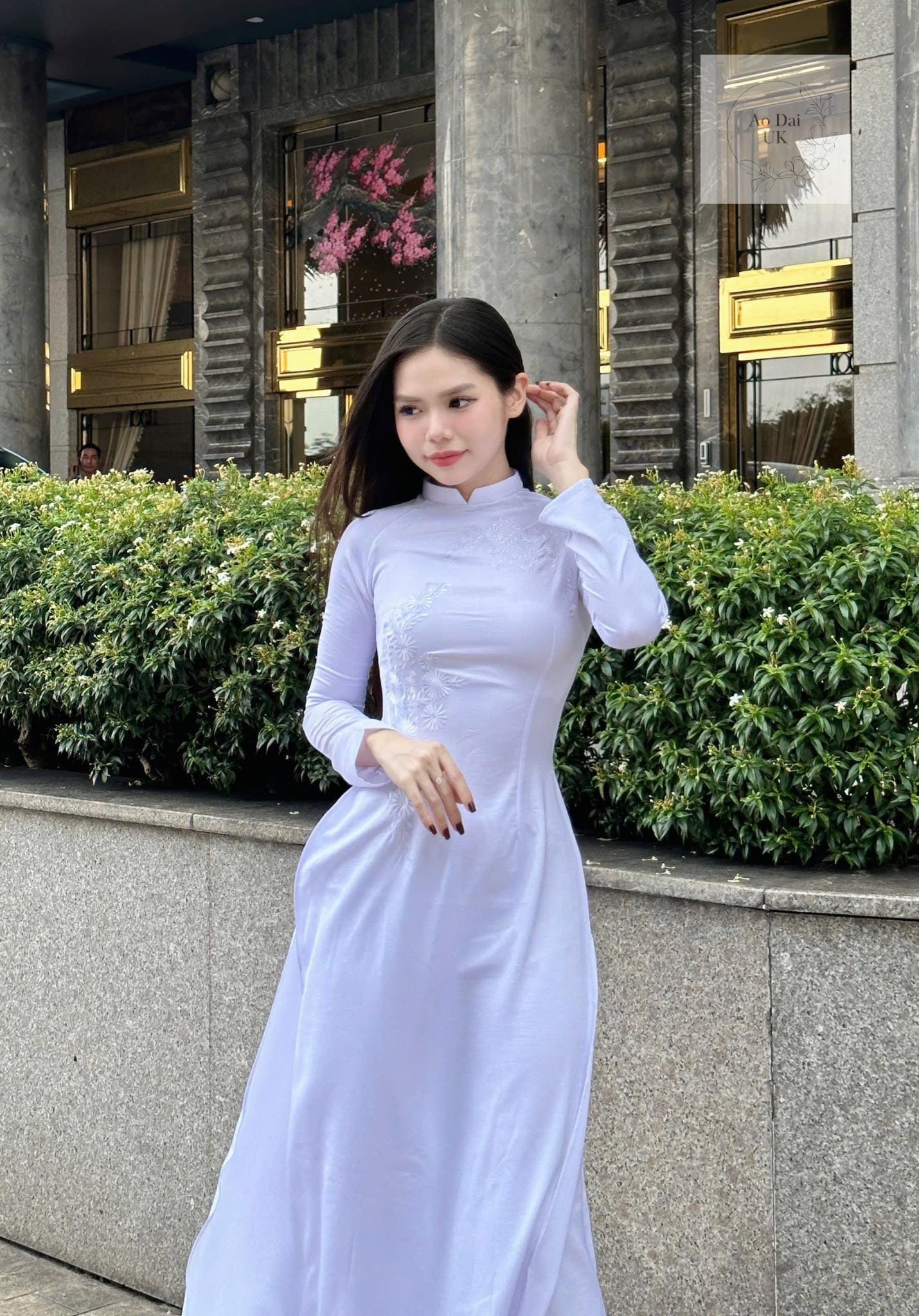 Traditional white ao dai with floral embroidery
