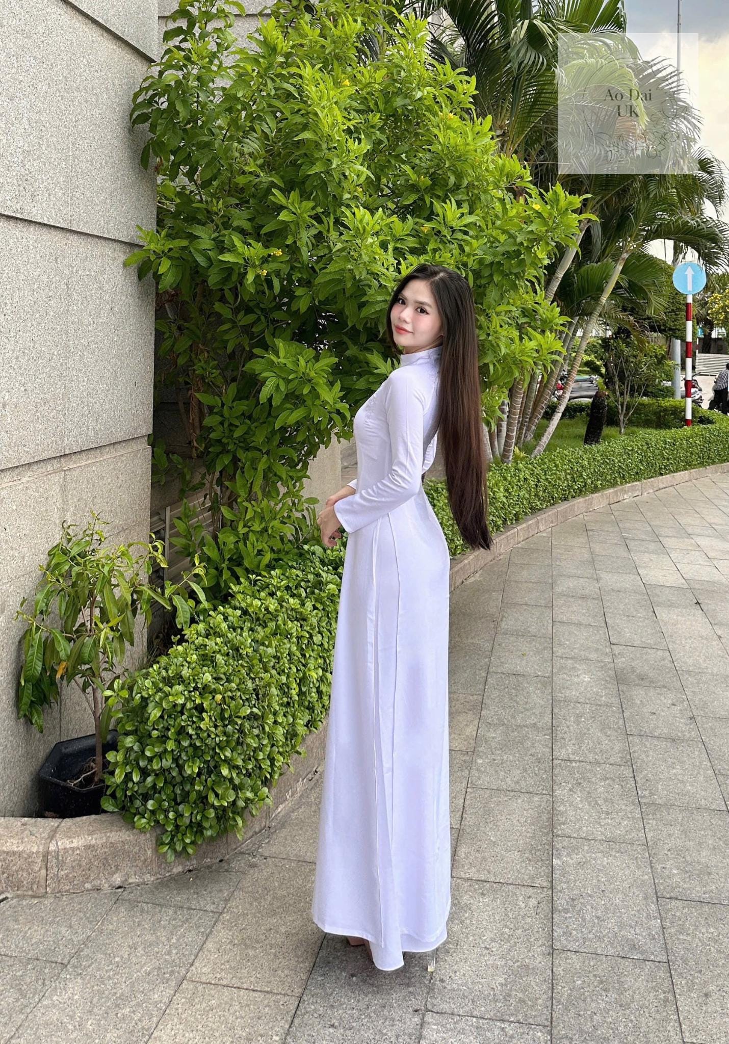 Traditional white ao dai with floral embroidery